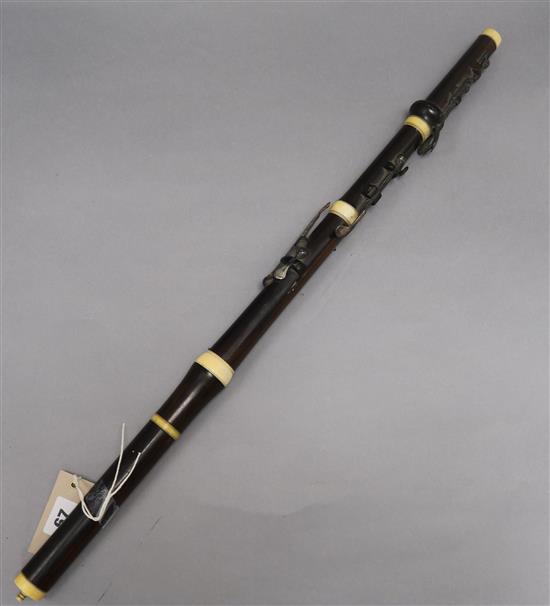 An ivory and silver mounted flute length 67cm